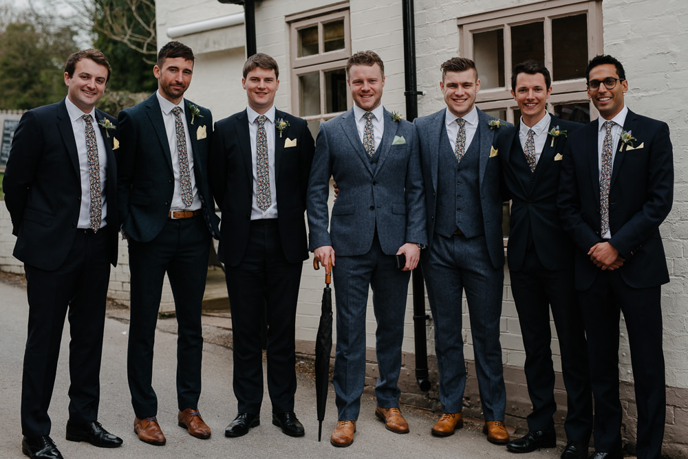Outdoor Farm Field Marquee Blue Navy Groom Groomsmen Yellow Buttonhole | Rustic and Relaxed Spring Tipi Wedding Inbetween Days Photography