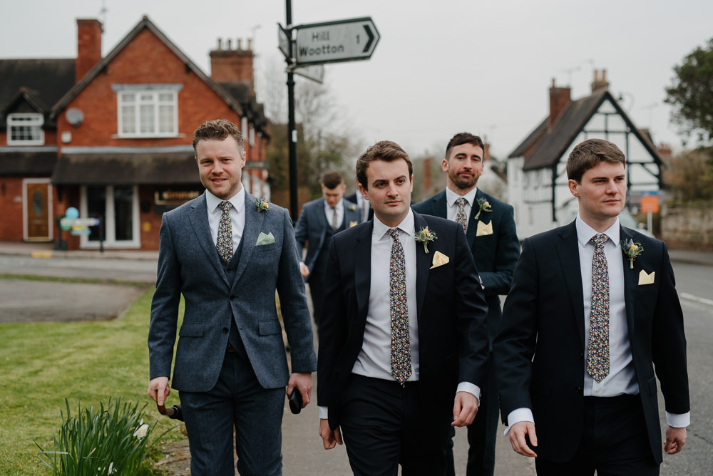 Outdoor Farm Field Marquee Blue Navy Groom Groomsmen Yellow Buttonhole | Rustic and Relaxed Spring Tipi Wedding Inbetween Days Photography