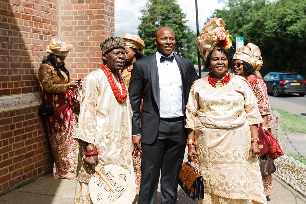 Hugo Boss Tuxedo Groom Nigerian Traditional Dress Gold Red Stoke Place Wedding Hannah McClune Photography