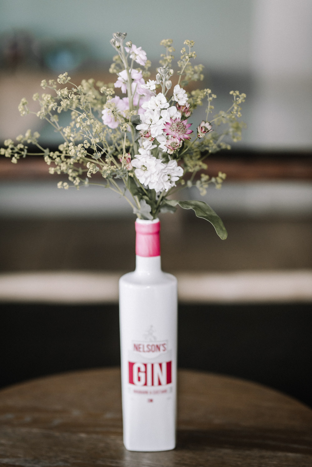 Gin Bottle Flowers Table Pretty Pink Greenery Decor Stone Barn Wedding Oobaloos Photography