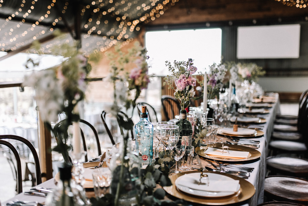 Gin Bottle Flowers Table Pretty Pink Greenery Decor Stone Barn Wedding Oobaloos Photography