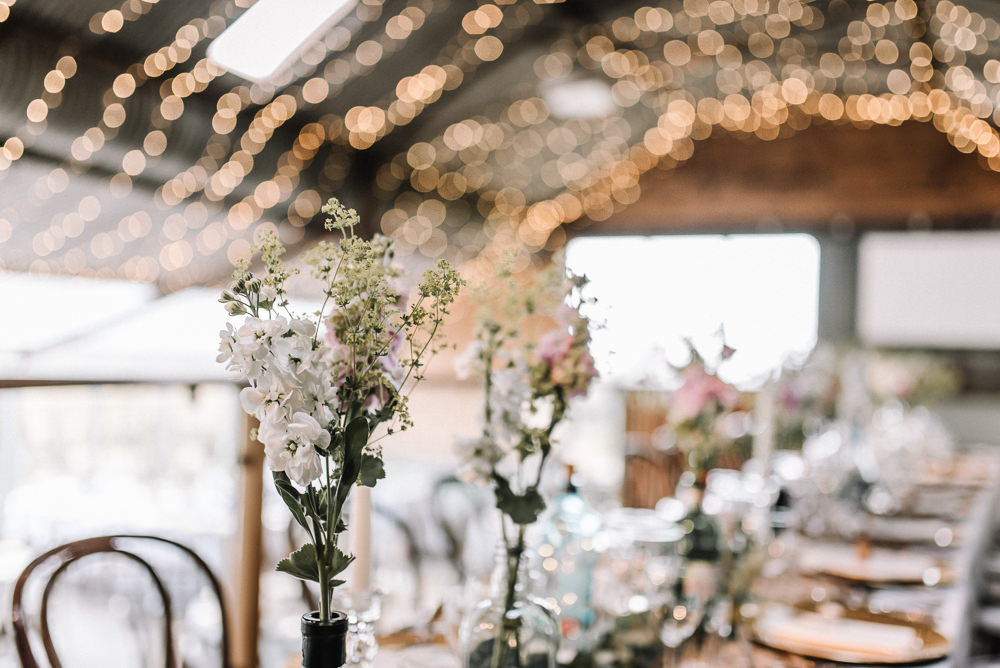 Gin Bottle Flowers Table Pretty Pink Greenery Decor Stone Barn Wedding Oobaloos Photography