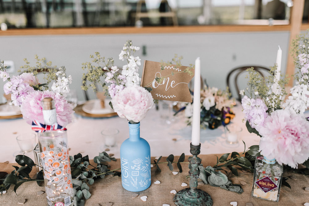 Gin Bottle Flowers Table Pretty Pink Greenery Decor Stone Barn Wedding Oobaloos Photography
