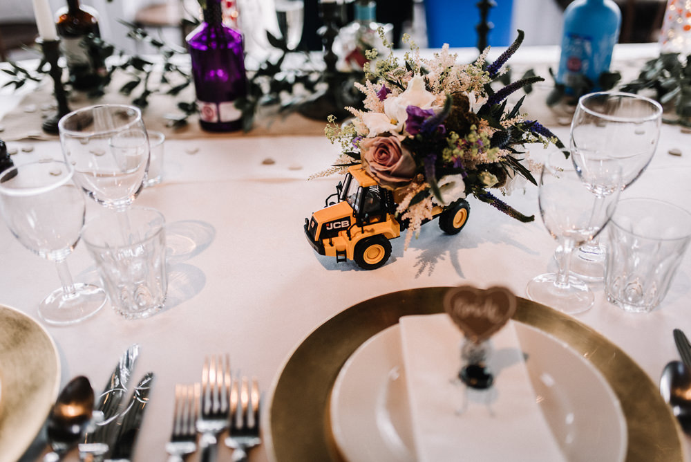 Gin Bottle Flowers Table Pretty Pink Greenery Decor Toy Car JCB Stone Barn Wedding Oobaloos Photography