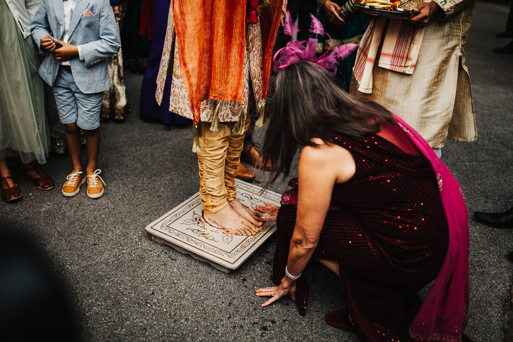 Styal Lodge Multicultural English Orange Pink Groom Henna Feet | Modern and Colorful Indian Wedding Emilie May Photography