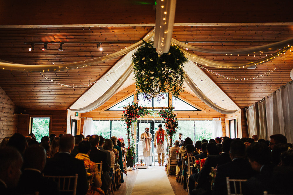 Styal Lodge Multicultural English Orange Pink Mandap Ceremony Ritual Aisle Groom | Modern and Colorful Indian Wedding Emilie May Photography