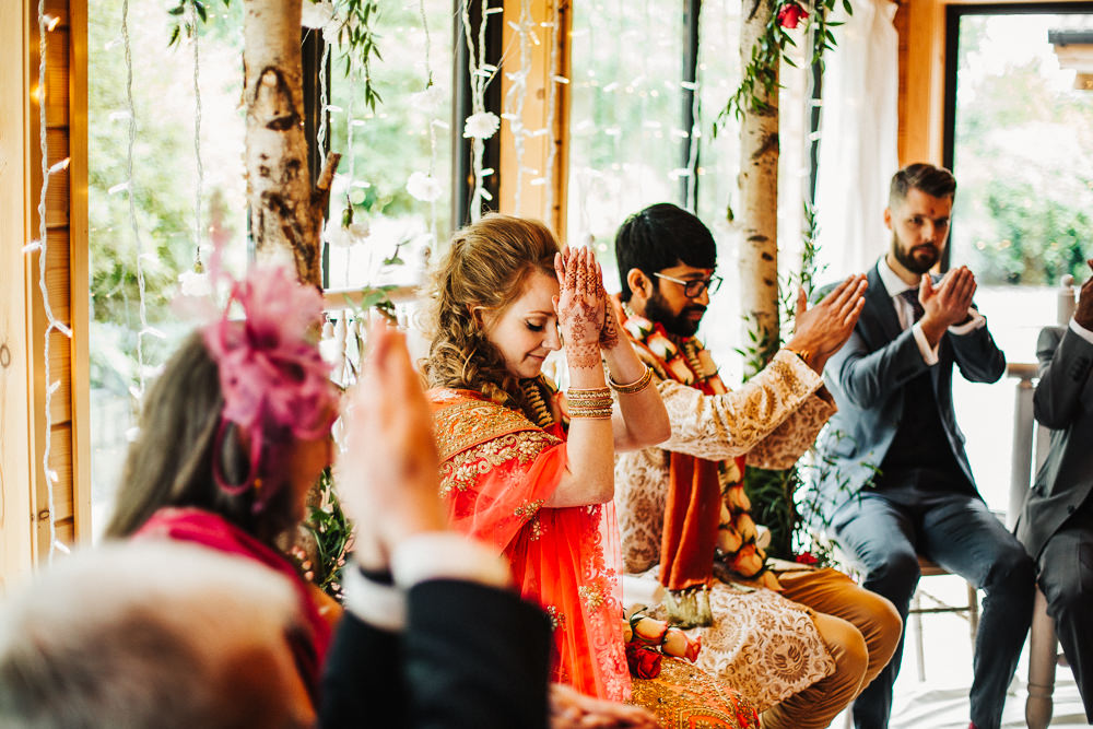Styal Lodge Multicultural English Orange Pink Mandap Ceremony Traditional Ritual Aisle Bride Groom | Modern and Colorful Indian Wedding Emilie May Photography