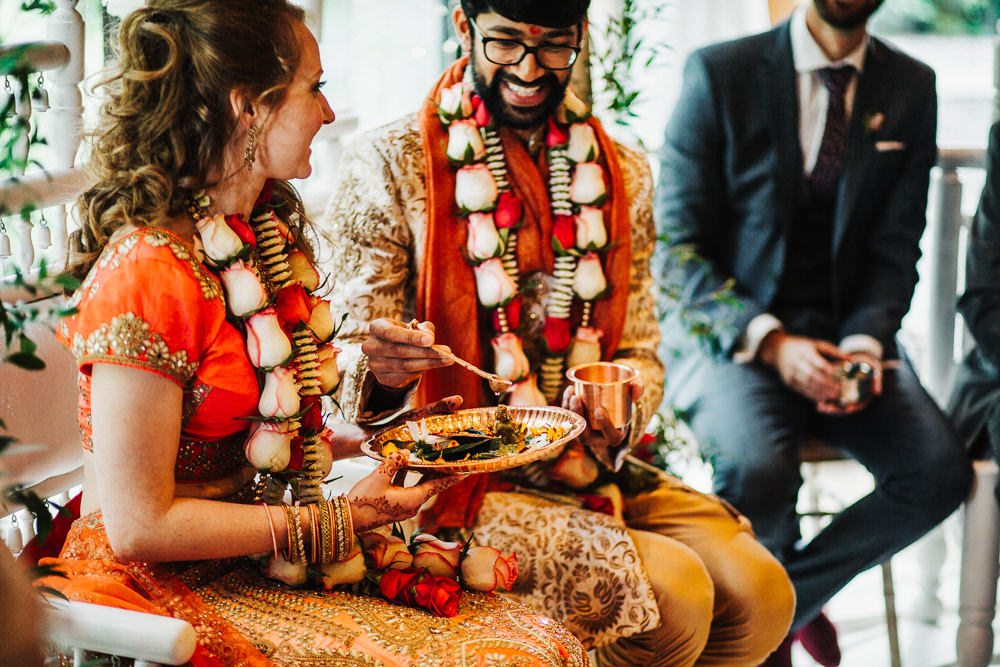 Styal Lodge Multicultural English Orange Pink Mandap Ceremony Traditional Ritual Aisle Bride Groom | Modern and Colorful Indian Wedding Emilie May Photography