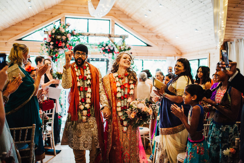 Styal Lodge Multicultural English Orange Pink Mandap Ceremony Traditional Ritual Aisle Bride Groom | Modern and Colorful Indian Wedding Emilie May Photography