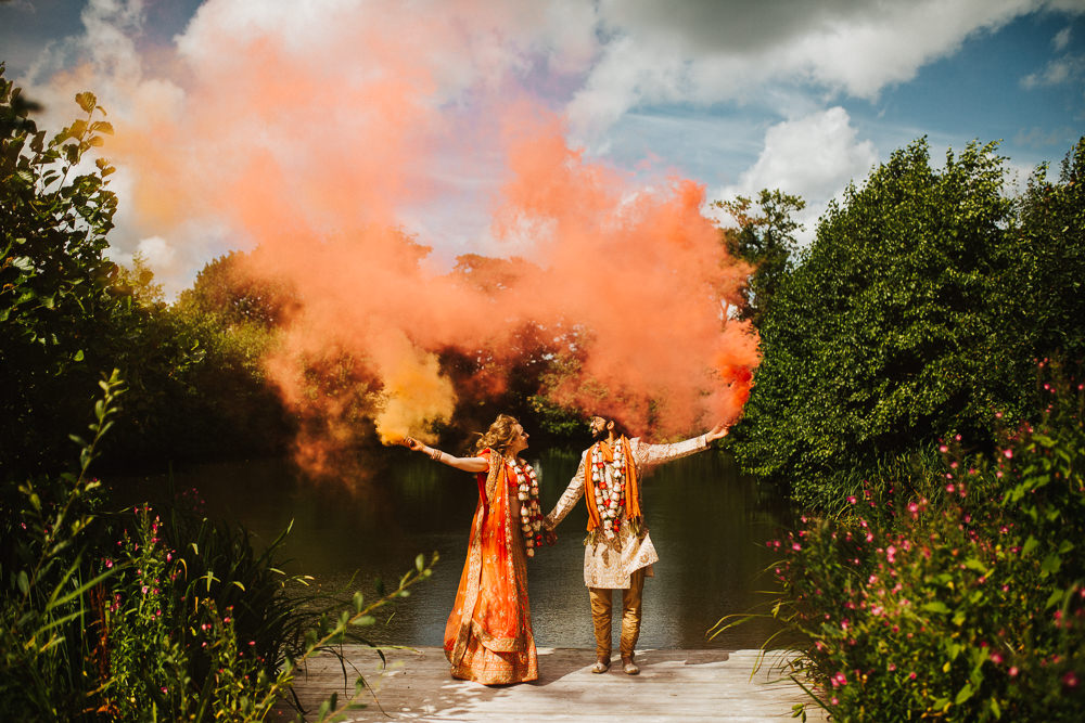 Styal Lodge Multicultural English Orange Smoke Bomb Bride Groom Forest Field | Modern and Colorful Indian Wedding Emilie May Photography