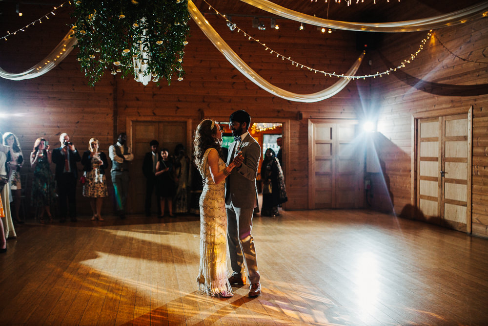 Styal Lodge Multicultural English Bride Groom Slow First Dance Wooden Barn | Modern and Colorful Indian Wedding Emilie May Photography
