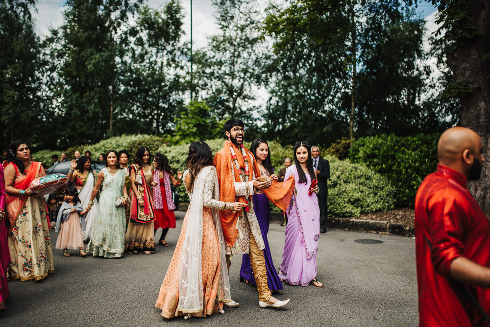 Styal Lodge Multicultural English Orange Pink Groom Entrance Dhol Drums | Modern and Colorful Indian Wedding Emilie May Photography