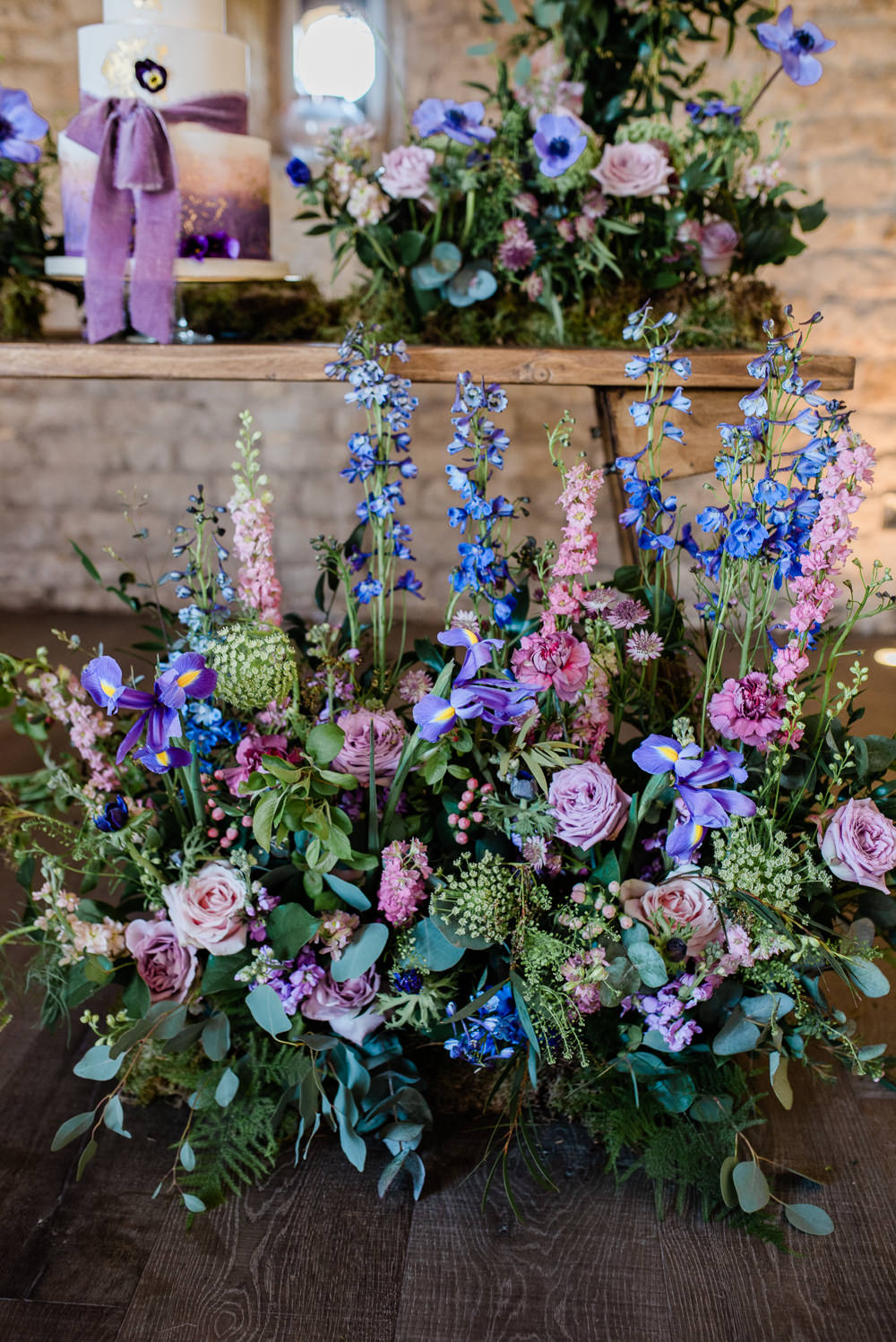 Iris Rose Delphiniums Backdrop Lilac Greenery Hoop Wreath Foliage Table Meadow Purple Ultra Violet Wedding Moon Gate Flower Arch Captured by Katrina Photography