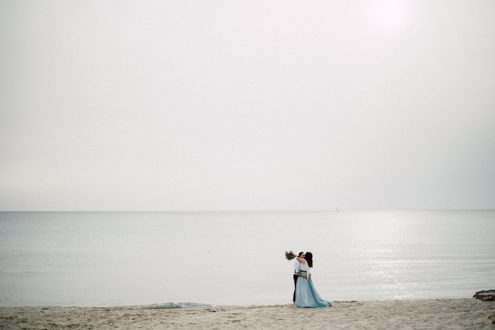 Outdoor Wild Nature Destination Spain Europe Beach Styled Shoot Groom Braces Bride Blue Gown Lace | Blue Ibiza Elopement Ideas and Surprise Proposal Serena Genovese Photography