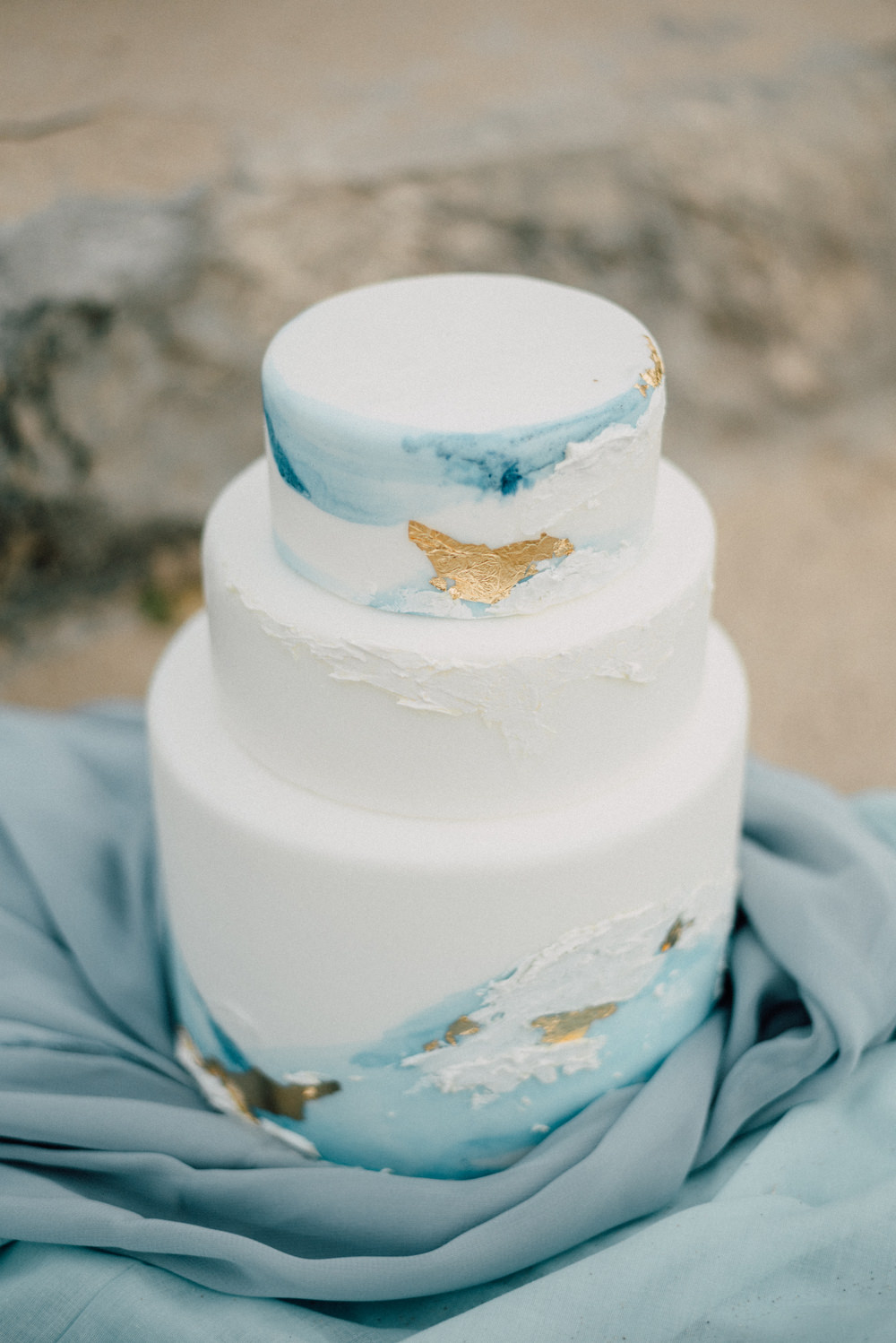 Outdoor Wild Nature Destination Spain Europe Beach Styled Shoot White Watercolor Brush Cake Gold Leaf | Blue Ibiza Elopement Ideas and Surprise Proposal Serena Genovese Photography