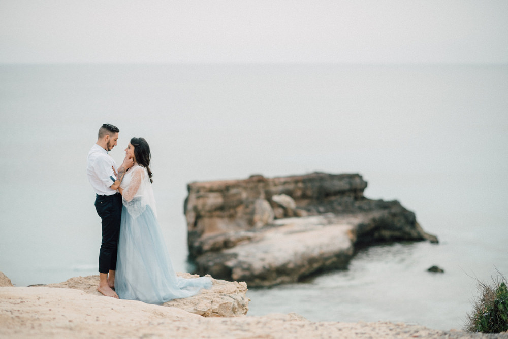 Outdoor Wild Nature Destination Spain Europe Beach Styled Shoot Groom Braces Bride Blue Gown Lace | Blue Ibiza Elopement Ideas and Surprise Proposal Serena Genovese Photography