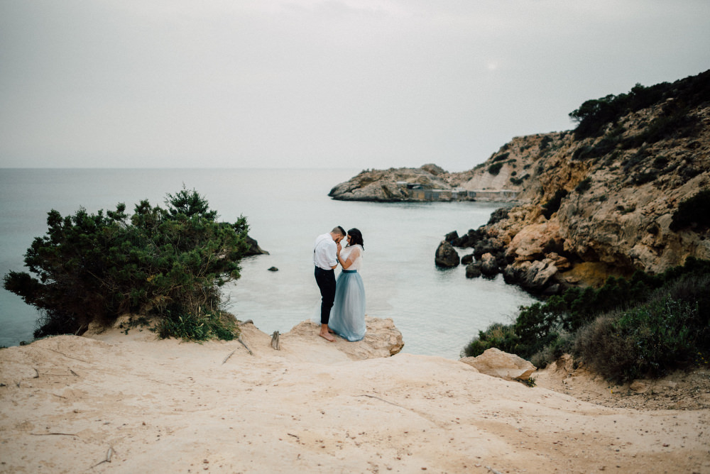 Outdoor Wild Nature Destination Spain Europe Beach Styled Shoot Groom Braces Bride Blue Gown Lace | Blue Ibiza Elopement Ideas and Surprise Proposal Serena Genovese Photography