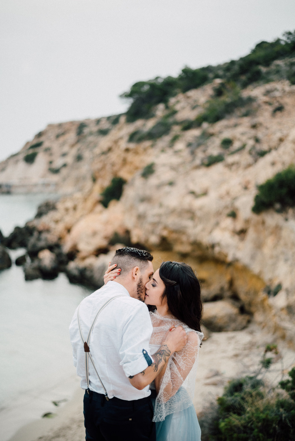 Outdoor Wild Nature Destination Spain Europe Beach Styled Shoot Groom Braces Bride Blue Gown Lace | Blue Ibiza Elopement Ideas and Surprise Proposal Serena Genovese Photography