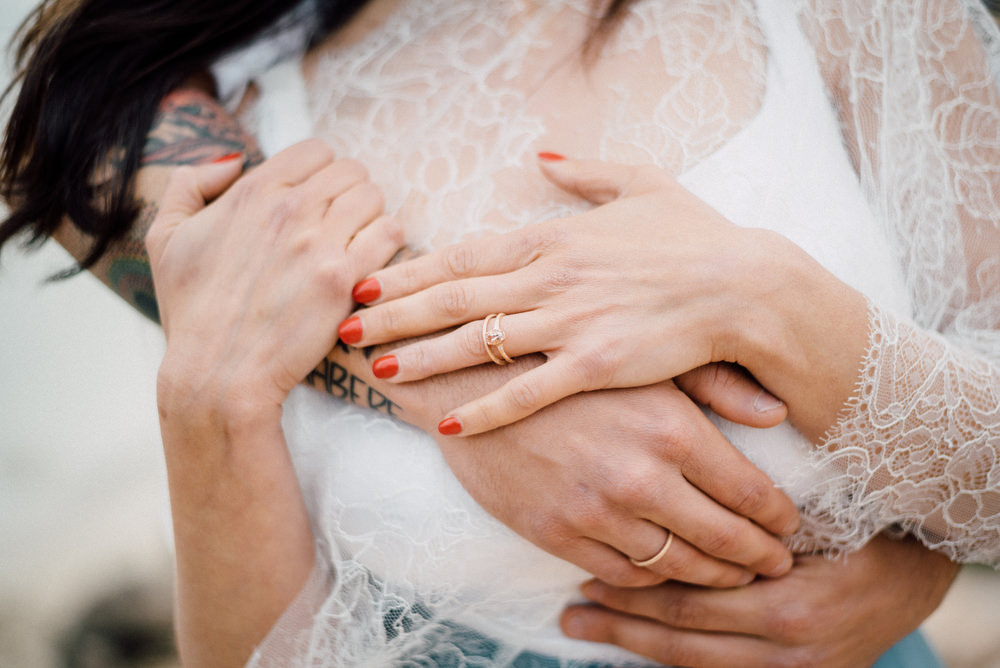 Outdoor Wild Nature Destination Spain Europe Beach Styled Shoot Groom Braces Bride Blue Gown Lace Rings | Blue Ibiza Elopement Ideas and Surprise Proposal Serena Genovese Photography