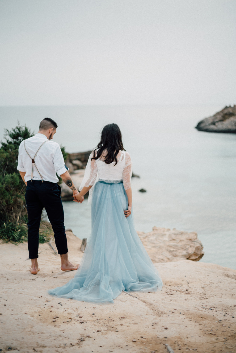 Outdoor Wild Nature Destination Spain Europe Beach Styled Shoot Groom Braces Bride Blue Gown Lace | Blue Ibiza Elopement Ideas and Surprise Proposal Serena Genovese Photography