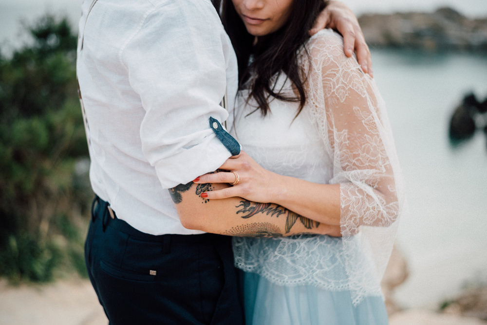 Outdoor Wild Nature Destination Spain Europe Sea Beach Styled Shoot Groom Braces Bride Blue Gown Lace | Blue Ibiza Elopement Ideas and Surprise Proposal Serena Genovese Photography
