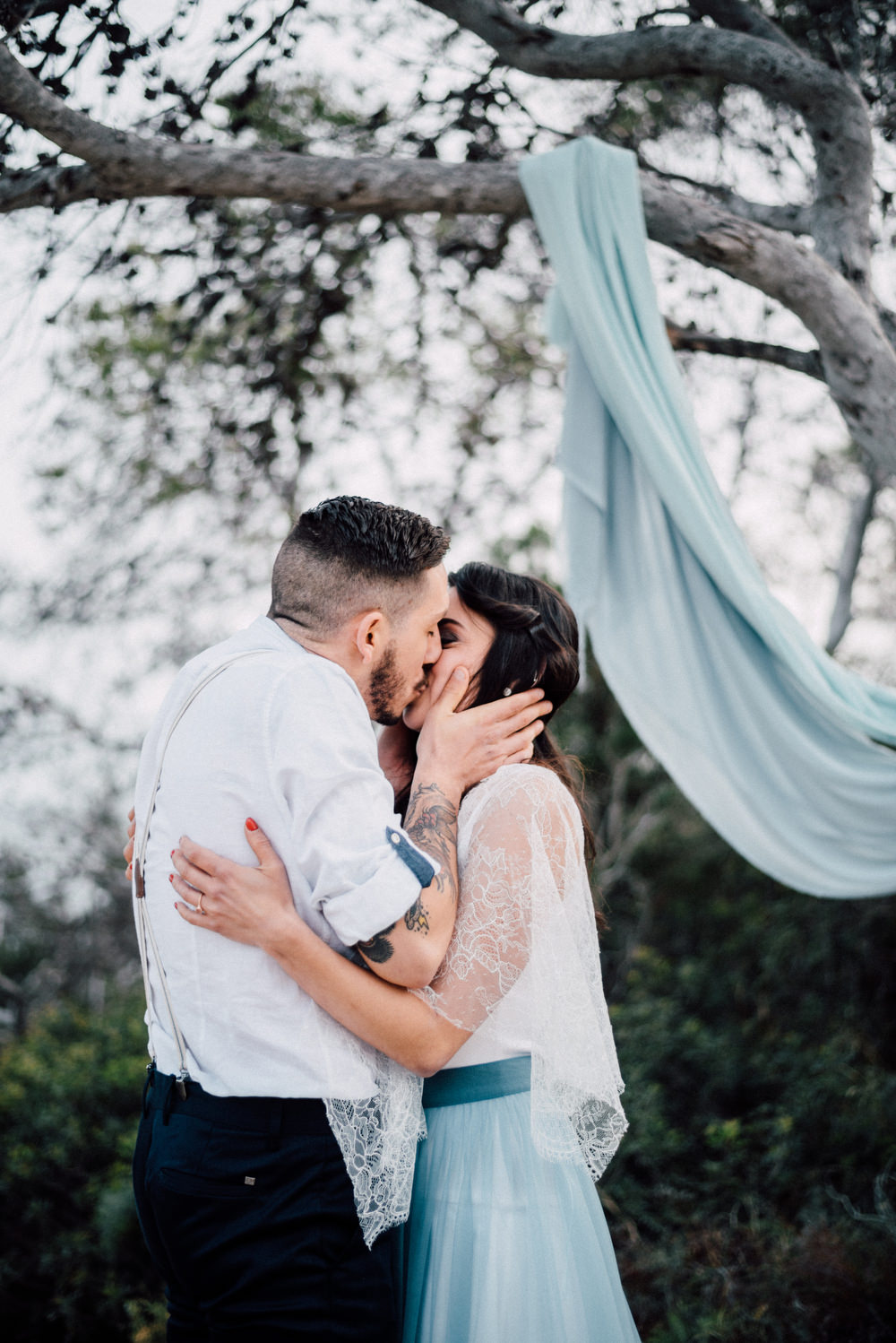 Outdoor Wild Nature Destination Spain Europe Sea Beach Styled Shoot Groom Braces Bride Blue Gown Lace Ceremony | Blue Ibiza Elopement Ideas and Surprise Proposal Serena Genovese Photography