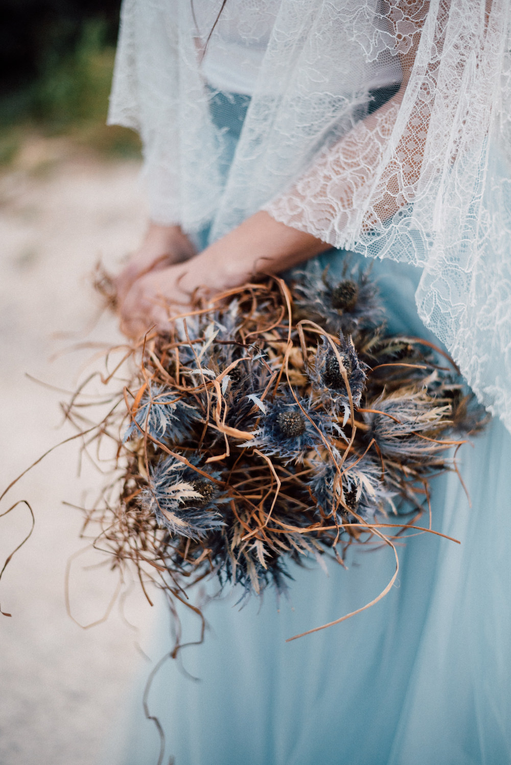 Outdoor Wild Nature Destination Spain Europe Sea Beach Styled Shoot Bride Blue Gown Lace Sea Holly Bouquet | Blue Ibiza Elopement Ideas and Surprise Proposal Serena Genovese Photography