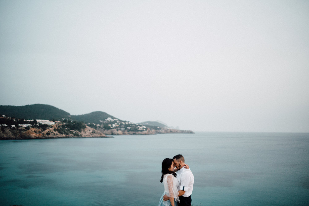 Outdoor Wild Nature Destination Spain Europe Sea Beach Styled Shoot Groom Braces Bride Blue Gown Lace | Blue Ibiza Elopement Ideas and Surprise Proposal Serena Genovese Photography