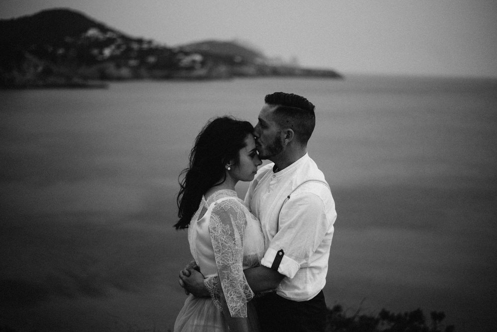 Outdoor Wild Nature Destination Spain Europe Sea Beach Styled Shoot Groom Braces Bride Blue Gown Lace | Blue Ibiza Elopement Ideas and Surprise Proposal Serena Genovese Photography