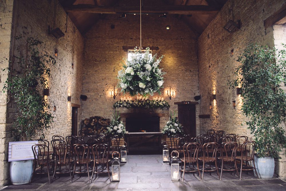 Flowers Greenery Foliage Cream Peony Peonies Rose Candles Decor Ceremony Aisle Cripps Barn Botanical Country Wedding Jenna Woodward Photography