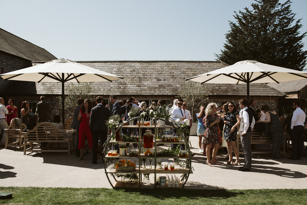 Travel Wine Inspired Rustic Outdoor Natural Farm Field Drinks Reception Circular Shelves Greenery | Farbridge Barn Wedding Jamie Dunn Photography