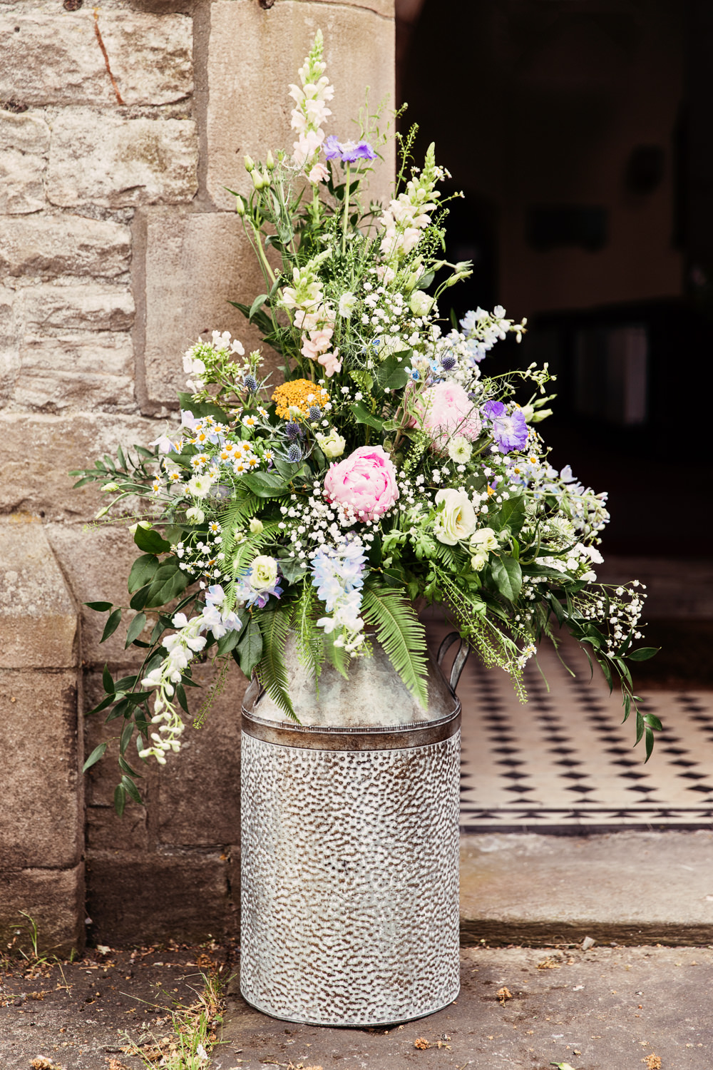 Milk Churn Wildflower Meadow Church Peony Fern Stock Daisy Festival Wedding Mismatched Country Camilla Lucinda Photography
