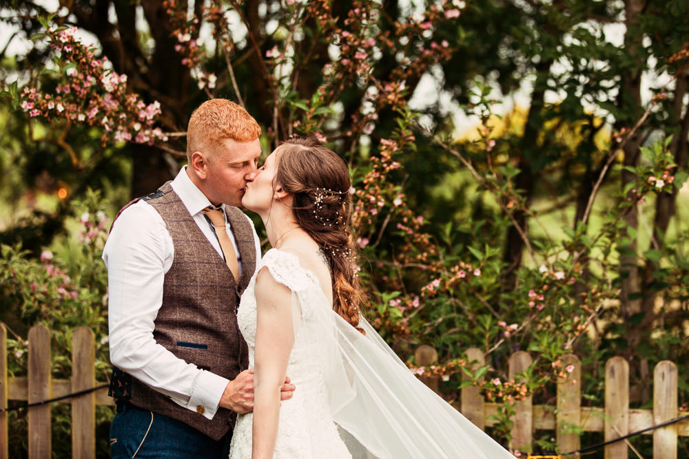 Bride Bridal Bespoke Dress Cape Sweetheart Neckline A Line Lace Tweed Mismatched Waistcoat Groom Festival Wedding Mismatched Country Camilla Lucinda Photography