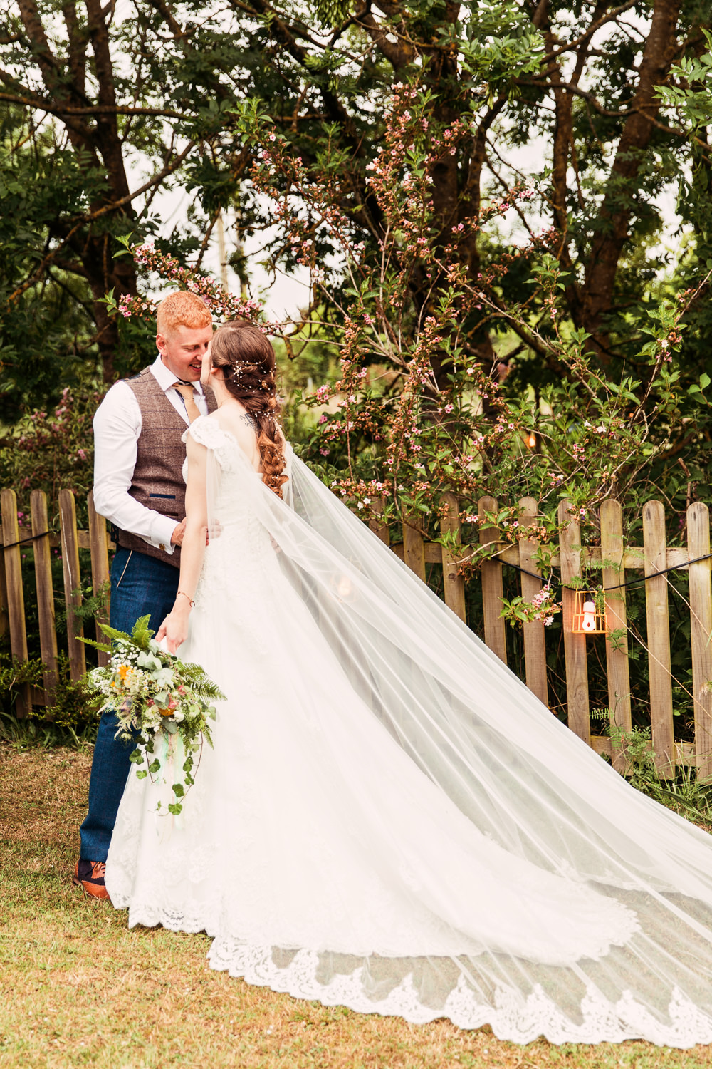 Bride Bridal Bespoke Dress Cape Sweetheart Neckline A Line Lace Tweed Mismatched Waistcoat Groom Embellished Plait Hair Meadow Wildflower Bouquet Festival Wedding Mismatched Country Camilla Lucinda Photography