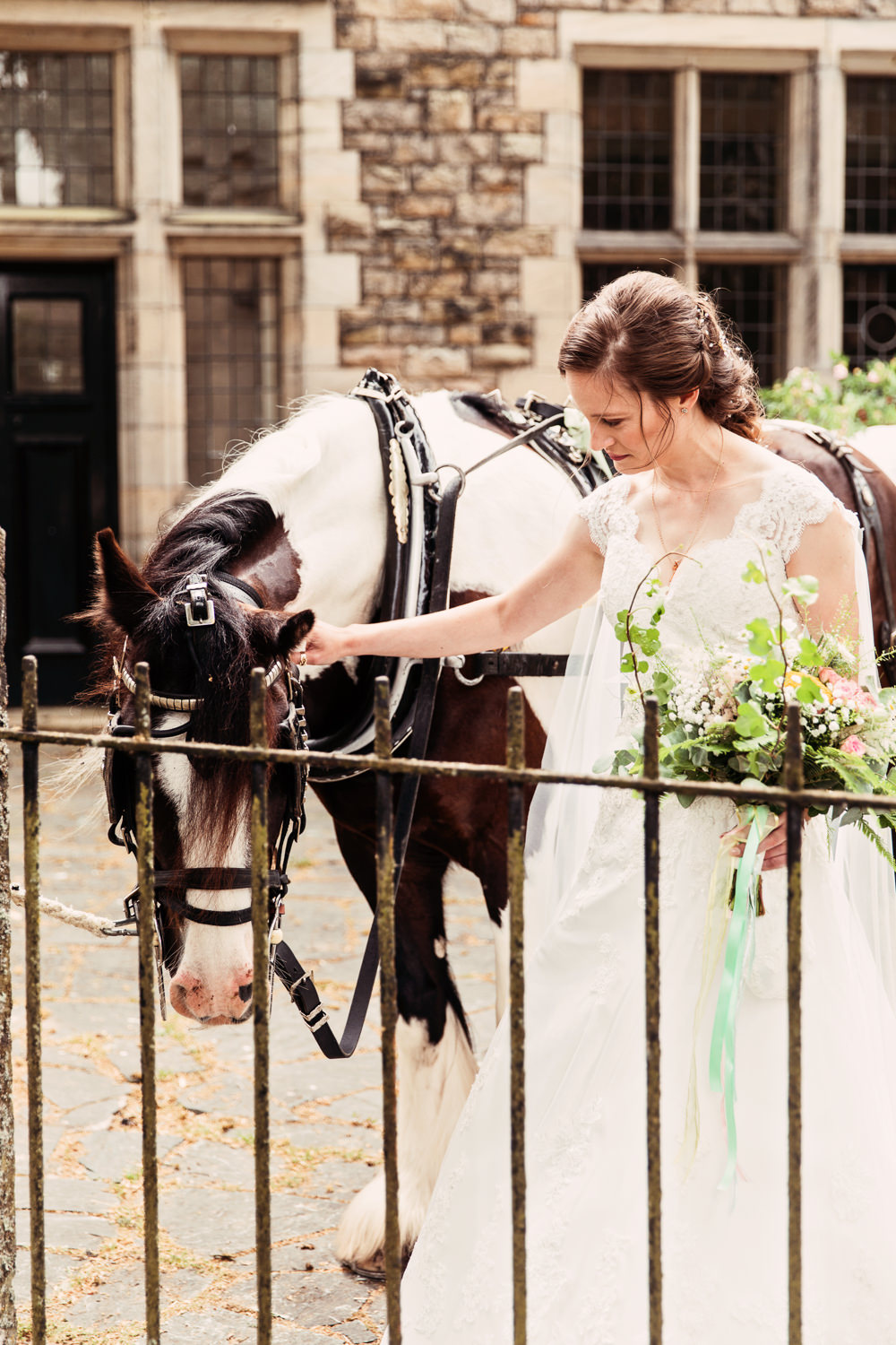 Bride Bridal Bespoke Dress Cape Sweetheart Neckline A Line Lace Wildflower Bouquet Horse Festival Wedding Mismatched Country Camilla Lucinda Photography