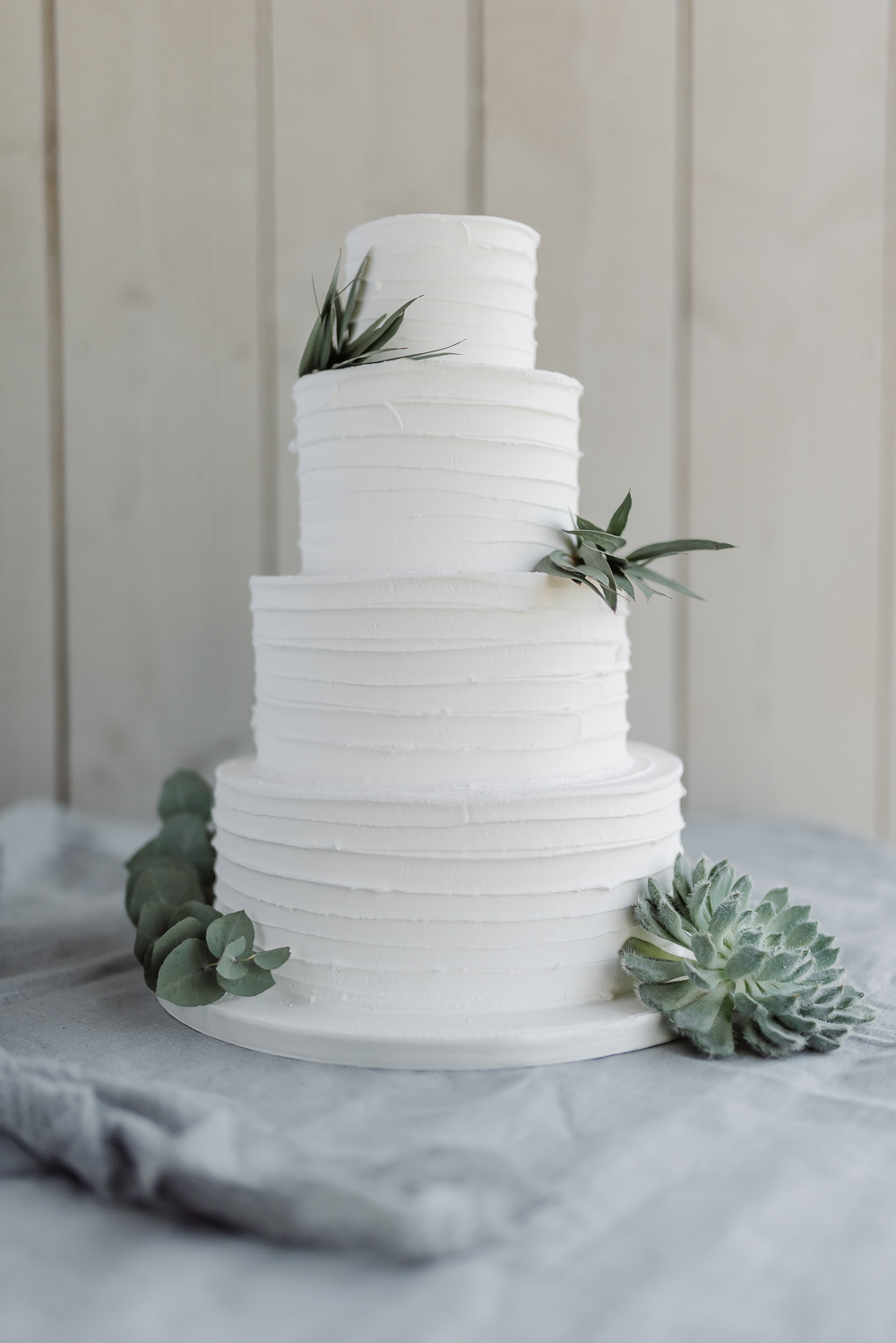 White Buttercream Iced Cake Foliage Succulents Grey Violet Wedding Ideas Chloe Ely Photography
