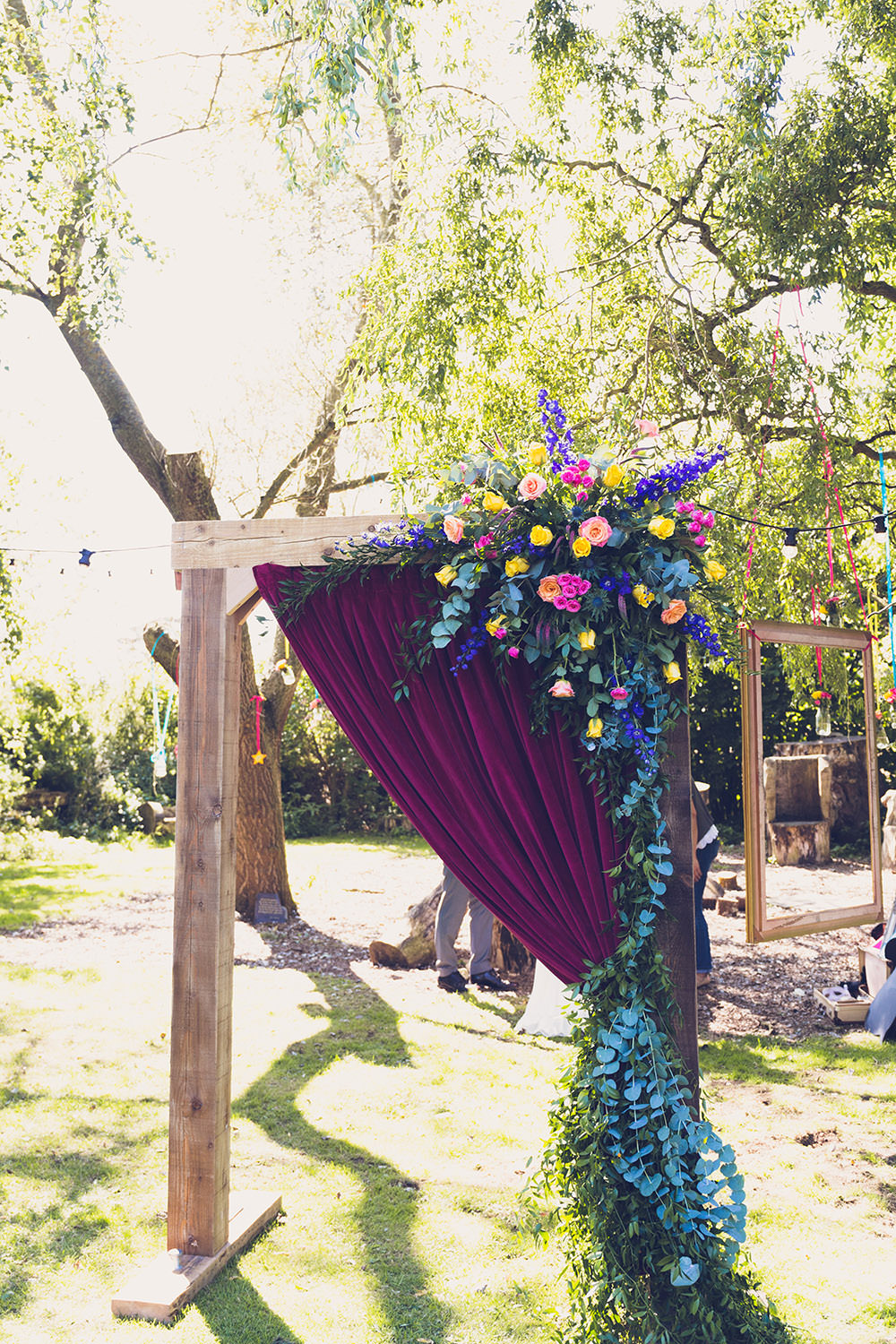 Flower Arch Florals Wooden Frame Multi Colour Colourful Backdrop Hothorpe Hall Woodlands Wedding Lucy Long Photography