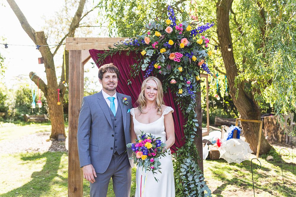 Flower Arch Florals Wooden Frame Multi Colour Colourful Backdrop Hothorpe Hall Woodlands Wedding Lucy Long Photography