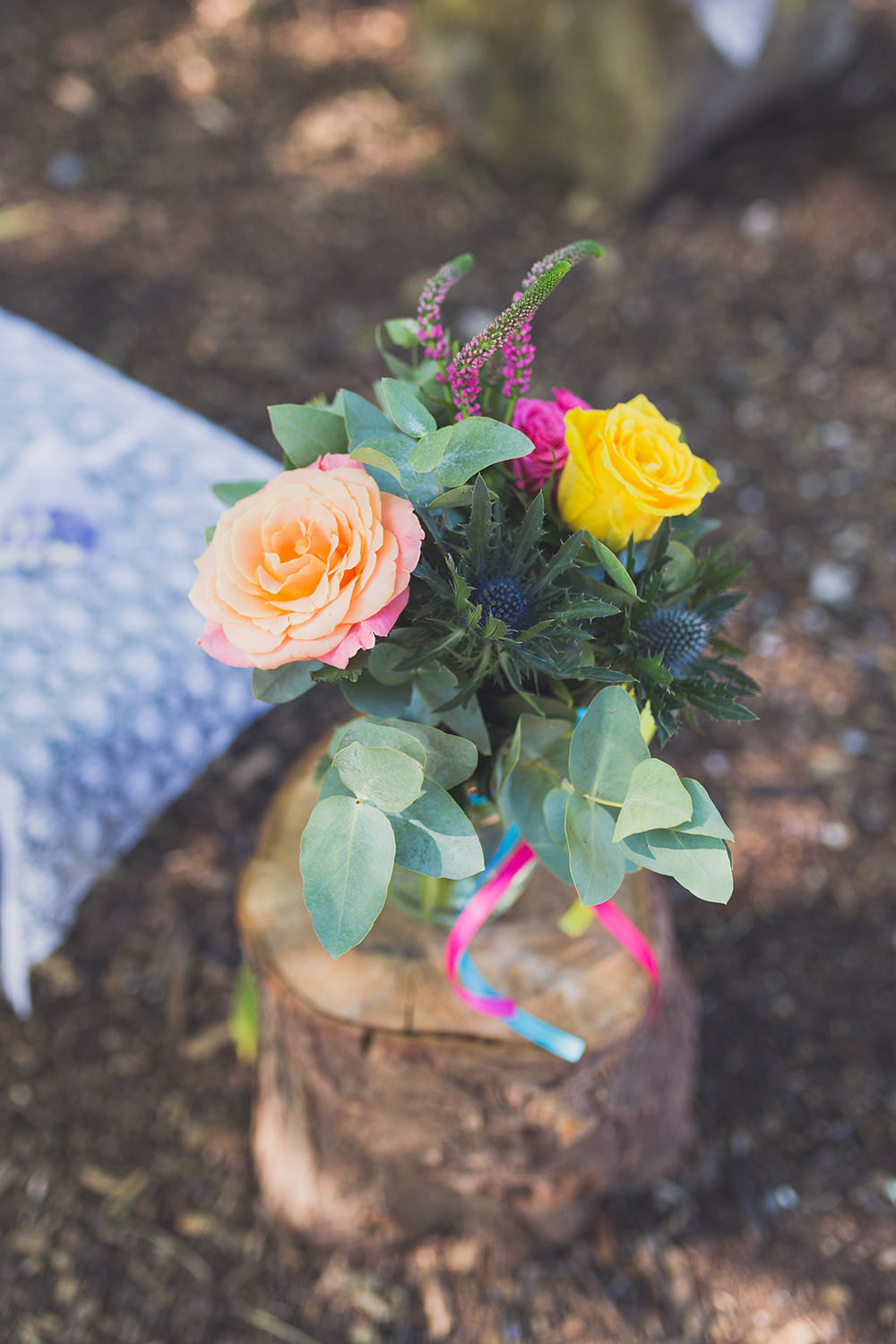 Aisle Ceremony Flowers Pew End Log Slice Rose Colourful Vase Coral Yellow Pink Hothorpe Hall Woodlands Wedding Lucy Long Photography