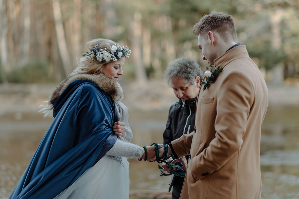 Forest Trees Castle Loch Bride Blue Dress White Bouquet Floral Crown Cape Father Ceremony | Intimate Winter Outdoor Scotland Wedding Christopher Ian Photography