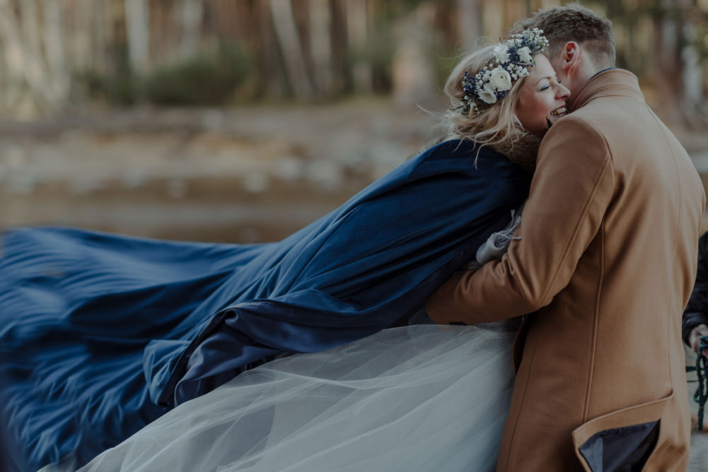 Forest Trees Castle Loch Bride Blue Dress White Bouquet Floral Crown Cape Father Ceremony | Intimate Winter Outdoor Scotland Wedding Christopher Ian Photography