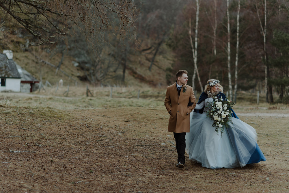 Forest Trees Castle Loch Bride Groom Blue Dress White Bouquet Floral Crown Cape Tan Coat | Intimate Winter Outdoor Scotland Wedding Christopher Ian Photography