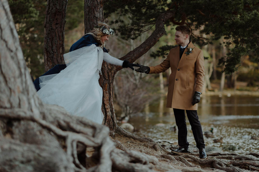 Forest Trees Castle Loch Bride Groom Blue Dress White Bouquet Floral Crown Cape Tan Coat | Intimate Winter Outdoor Scotland Wedding Christopher Ian Photography