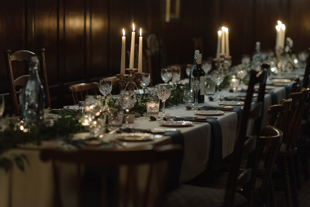 Forest Trees Castle Loch Simple Decor Greenery Fairy Lights Garland Runner Table Blue White | Intimate Winter Outdoor Scotland Wedding Christopher Ian Photography