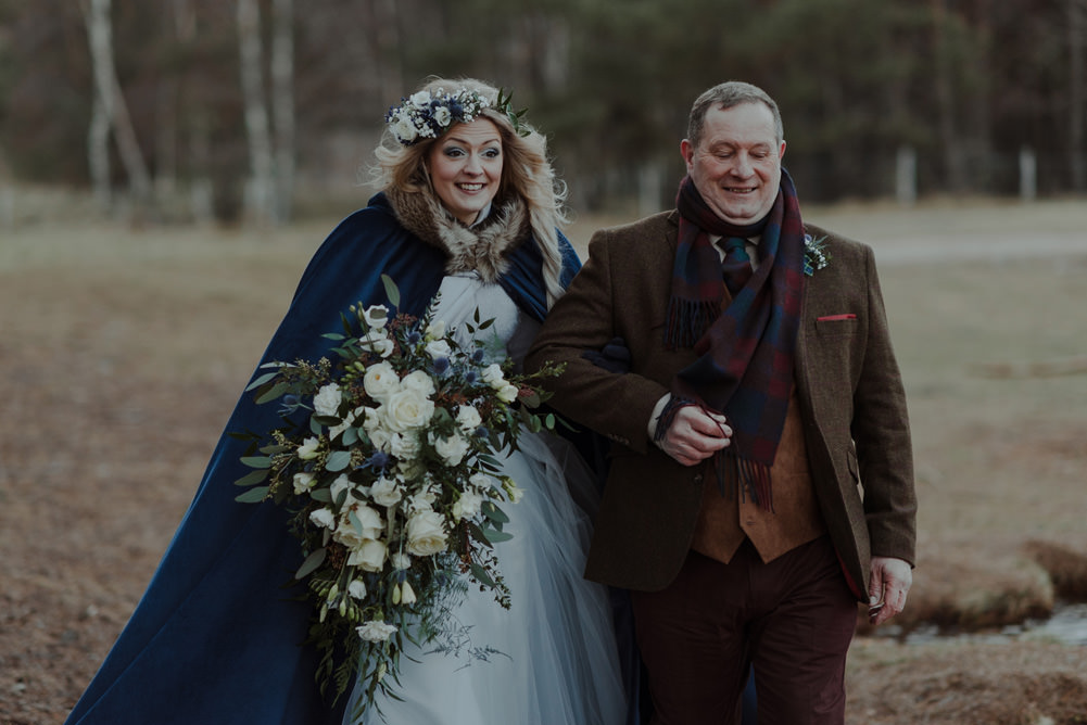 Forest Trees Castle Loch Bride Blue Dress White Bouquet Floral Crown Cape Father Ceremony | Intimate Winter Outdoor Scotland Wedding Christopher Ian Photography