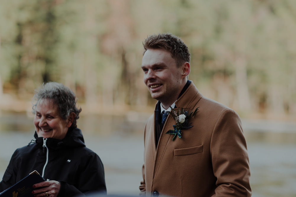 Forest Trees Castle Loch Bride Blue Dress White Bouquet Floral Crown Cape Father Ceremony | Intimate Winter Outdoor Scotland Wedding Christopher Ian Photography