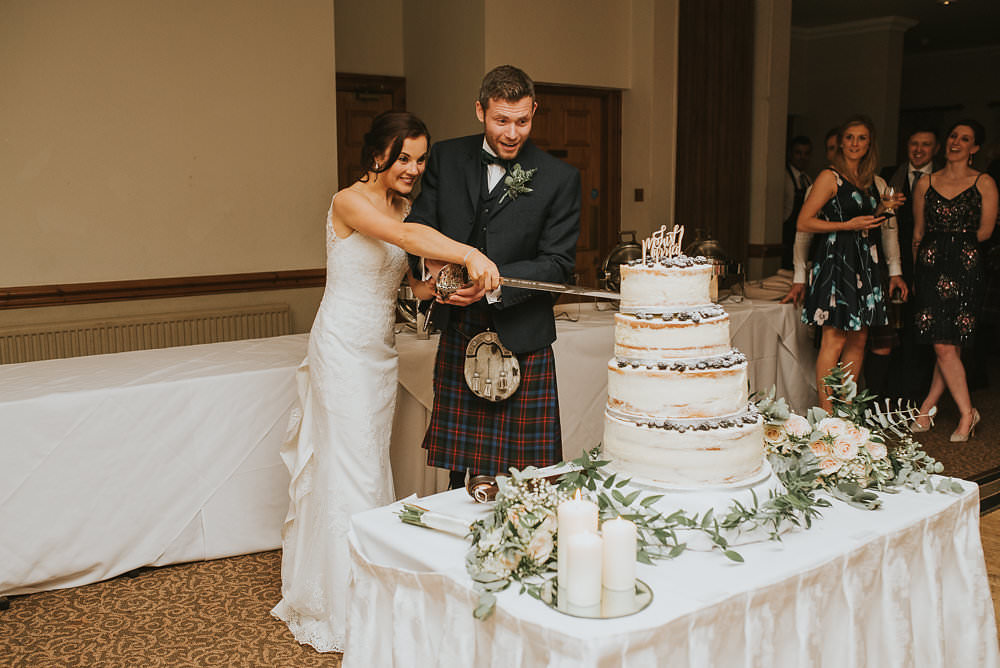 Bride Bridal Lace Sweetheart Neckline Straps Sleeveless Kilt Groom Bow Tie Cake Cutting Naked Berries Laser Cut Wooden Topper Macdonald Houston Hotel Wedding Martin Venherm Photography