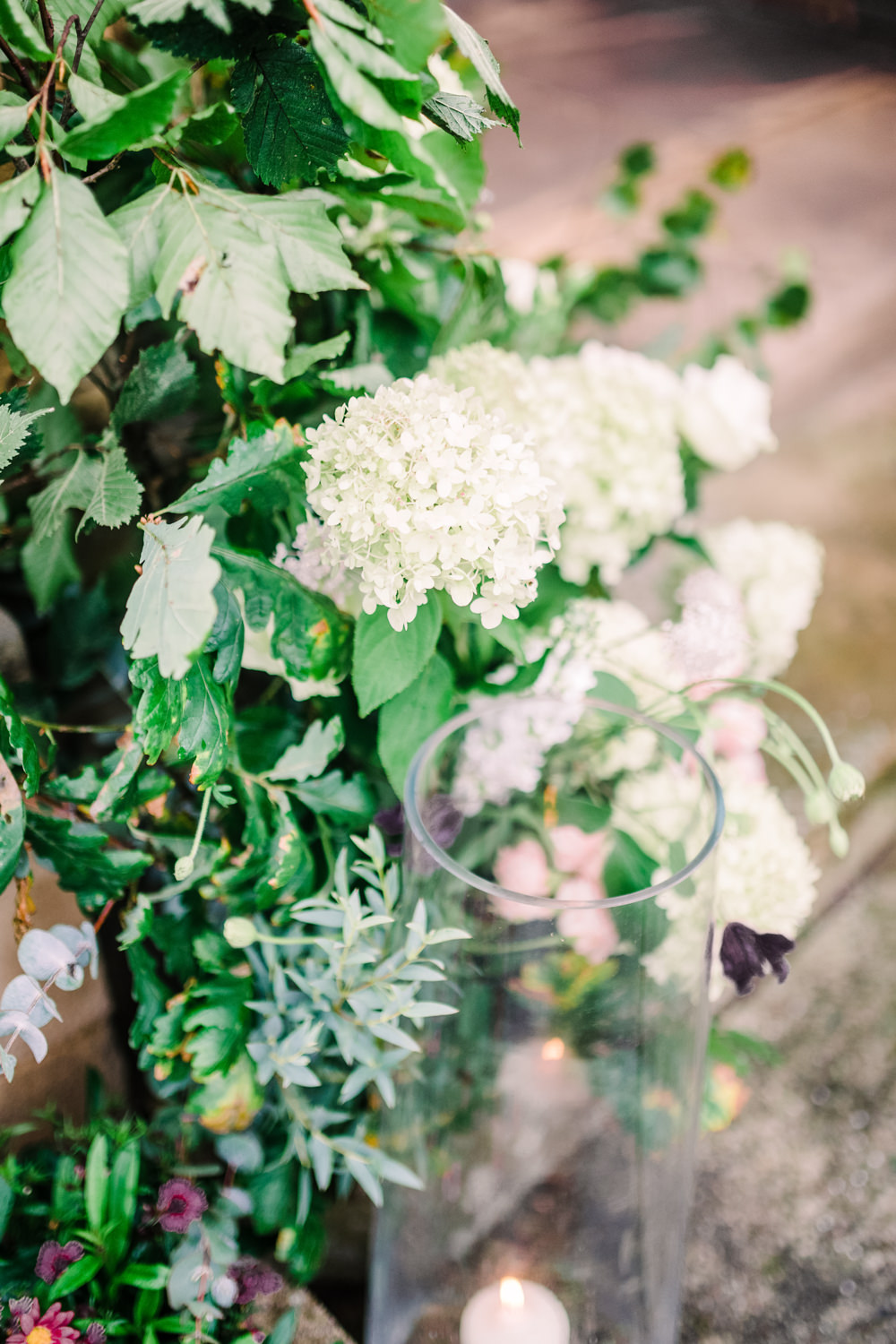 Church Entrance Flowers Hydrangea Rose Greenery Foliage Eucalyptus Arch Door Candles Pheasant Harome Wedding Yorkshire Arabella Smith Photography