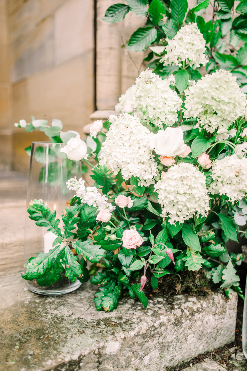 Church Entrance Flowers Hydrangea Rose Greenery Foliage Eucalyptus Arch Door Candles Pheasant Harome Wedding Yorkshire Arabella Smith Photography