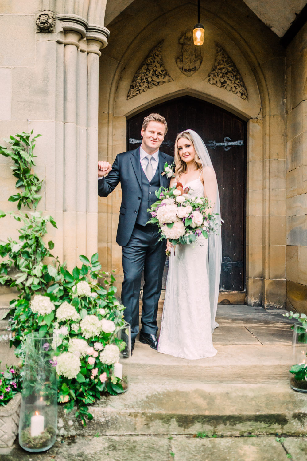 Church Entrance Flowers Hydrangea Rose Greenery Foliage Eucalyptus Arch Door Candles Pheasant Harome Wedding Yorkshire Arabella Smith Photography